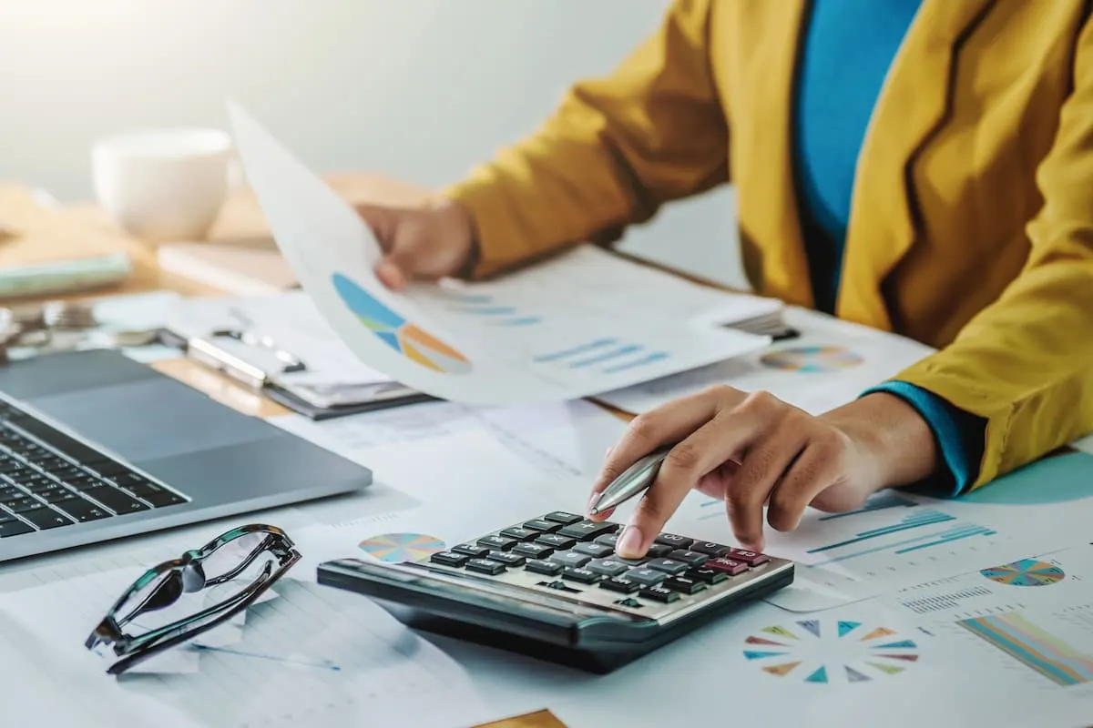 Financial analysis paperwork and calculator